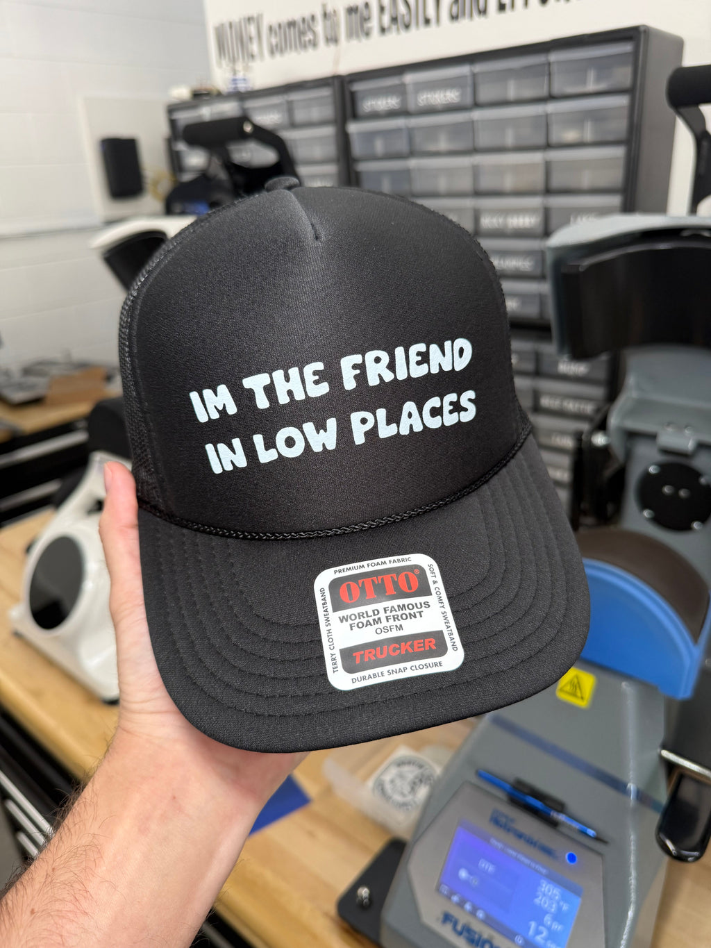 I'm The Friend in Low Places Trucker Hat
